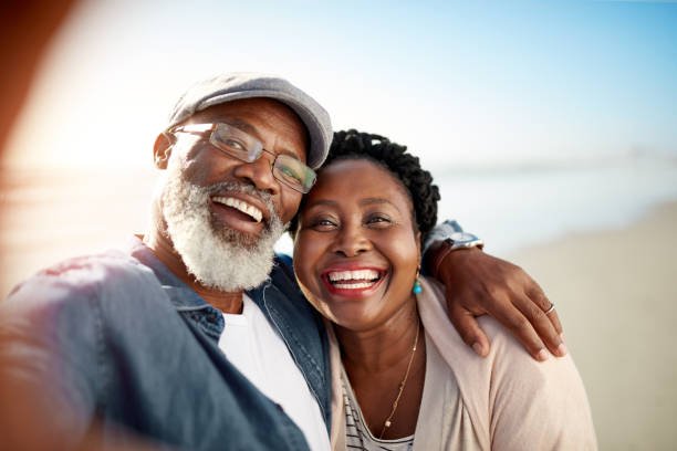 Happy couple taking a selfie on a scenic viewpoint